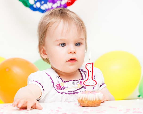 Little girl celebrating first birthday - Фото, изображение