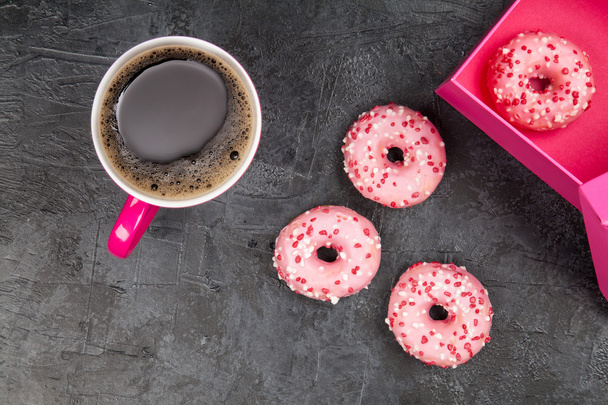 Tasty donuts on dark background - Фото, изображение
