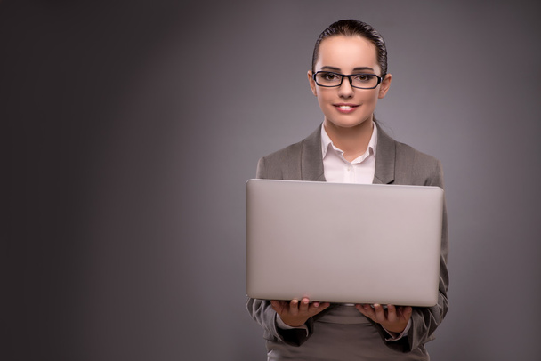 Young businesswoman working with laptop in business concept - Photo, Image
