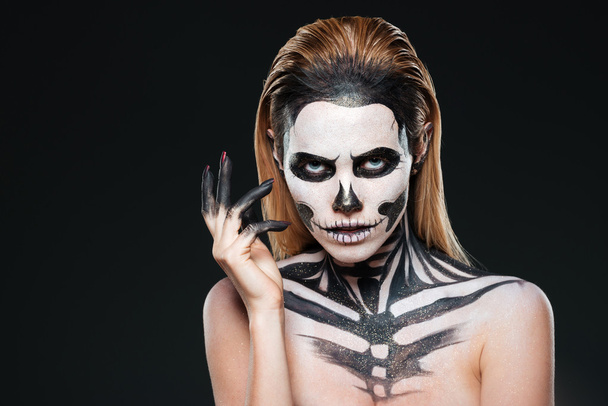 Portrait of young woman with scared halloween makeup - Foto, afbeelding