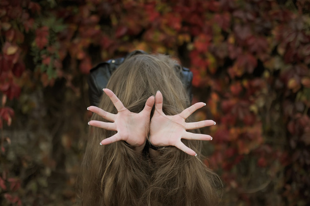 Top view photo of girl showing a sign by means  the fingers. - Valokuva, kuva