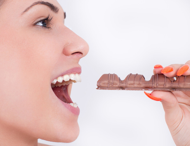 Girl eating chocolate - Photo, Image