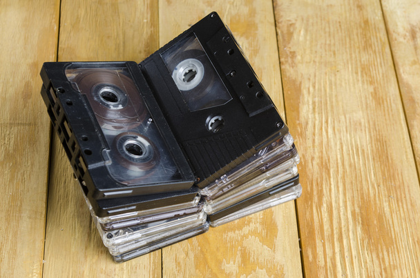 the cartridge for the tape recorder on a wooden table - Photo, Image