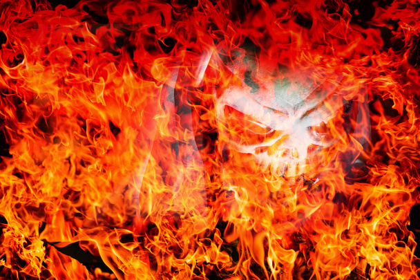 αφηρημένη κρανίο δαίμονας στην φλόγα φωτιά φλόγα υφή για το φόντο  - Φωτογραφία, εικόνα