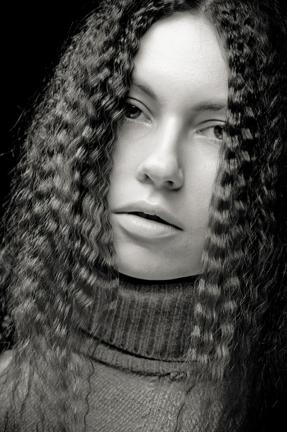 Portrait of pretty young woman with curly hair - Zdjęcie, obraz
