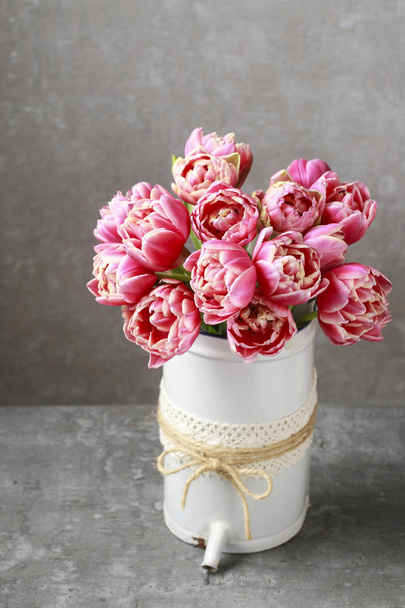 Bouquet of pink tulips in vintage can - Фото, изображение
