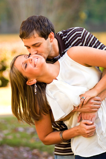 Lovestruck Couple Playfully Embrace - Photo, Image