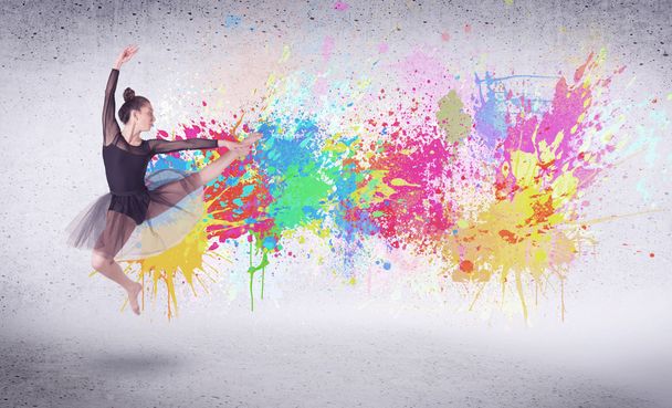 Modern street dancer jumping with colorful paint splashes - Foto, Imagem
