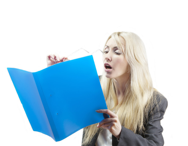 The blonde in a business suit looks in the folder with documents through  glasses - Photo, Image