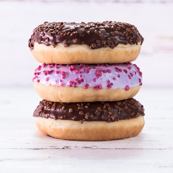 Donut. Sweet icing sugar food. Dessert colorful snack. Glazed sprinkles. - Foto, afbeelding