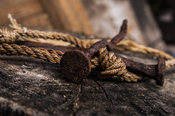  old rusty nail and rope - Zdjęcie, obraz