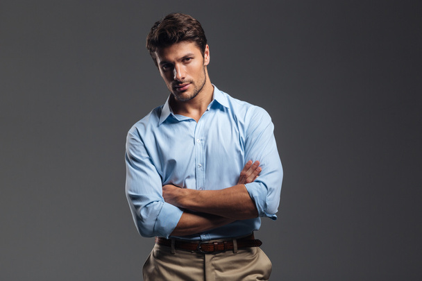 Successful handsome man with arms folded standing - Foto, Imagem