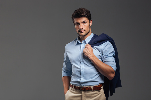 Handsome businessman holding his jacket over shoulder - Fotografie, Obrázek