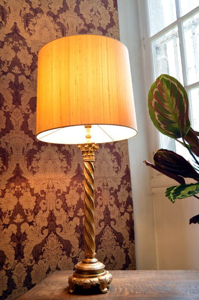 Old lamp of stay with a lampshade. - Foto, Bild