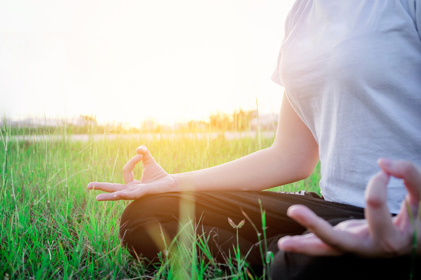 Yoga woman in the lotus posture Exercises Outdoor - Фото, зображення