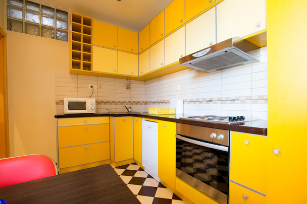 Interior of a modern yellow kitchen - 写真・画像