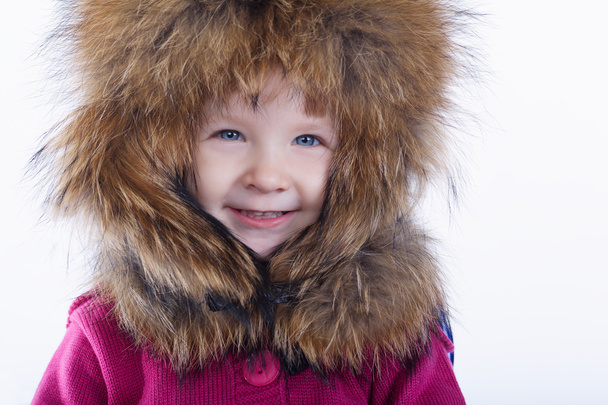 little girl with fur hat on white background - Foto, imagen