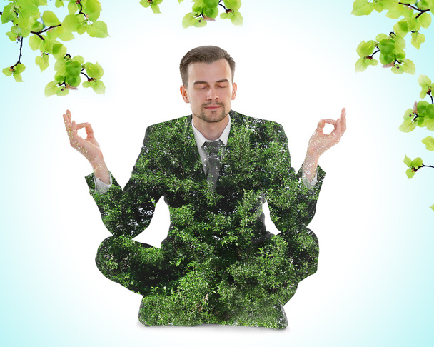 double exposure of meditating man and tree - Φωτογραφία, εικόνα