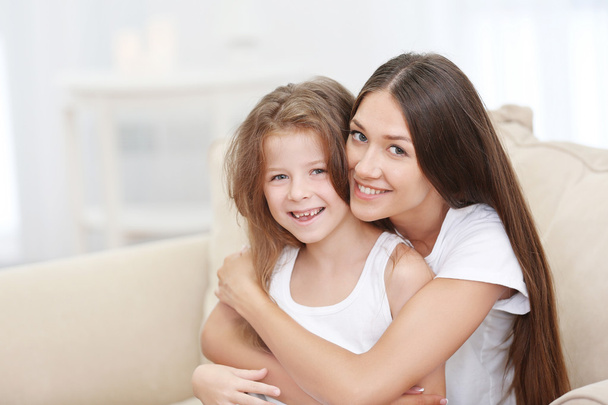 Cute girl with mother - Foto, imagen