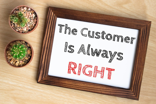 the customer is always right, text message on wood frame board on wood table / business concept / Top view - Foto, Bild