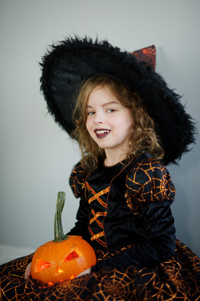 Beautiful girl of 8-9 years in image the evil fairy. - Фото, зображення