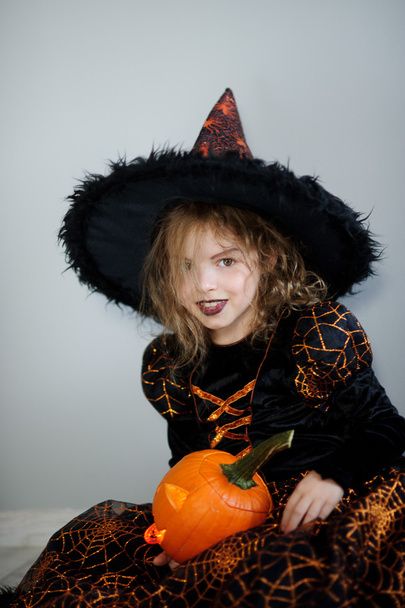Beautiful girl in an image of the evil witch - Photo, Image