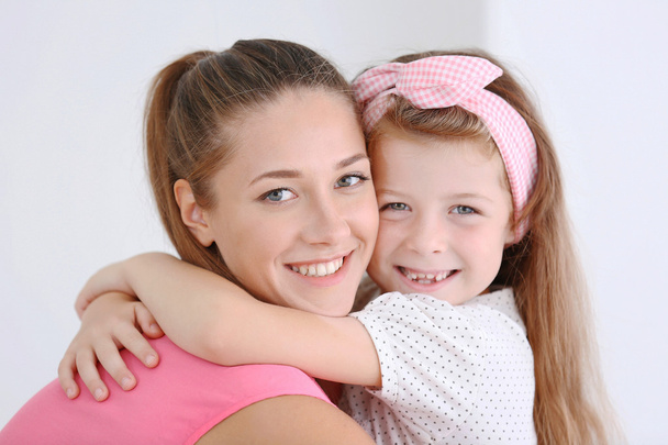 Cute girl with mother - Foto, Bild