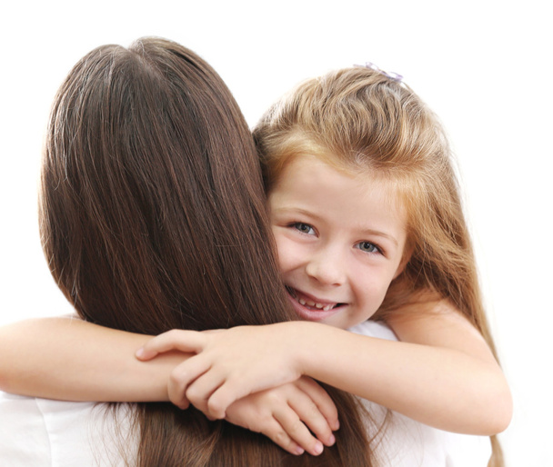 Cute girl hugging mother isolated on white background - 写真・画像