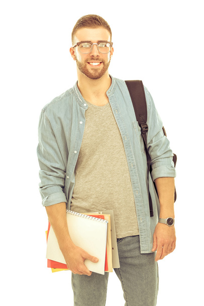 Un étudiant avec un sac d'école contenant des livres isolés sur fond blanc
 - Photo, image