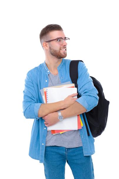 mužský student s školní batoh drží knihy izolovaných na bílém pozadí - Fotografie, Obrázek