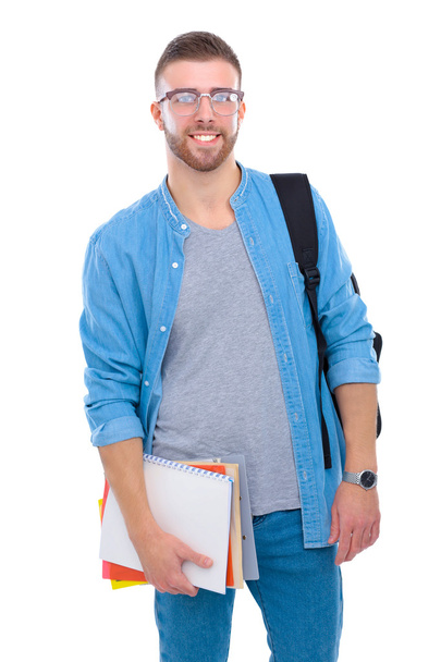 A male student with a school bag holding books isolated on white background - Fotoğraf, Görsel