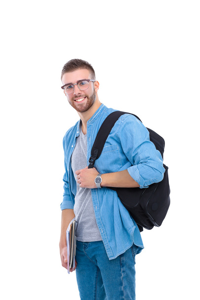 A male student with a school bag holding books isolated on white background - Fotoğraf, Görsel