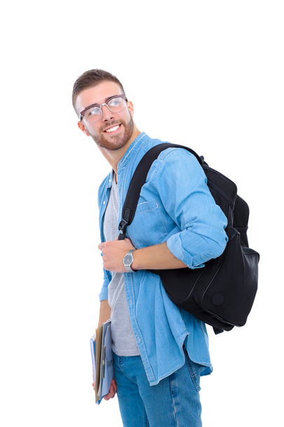A male student with a school bag holding books isolated on white background - Foto, imagen