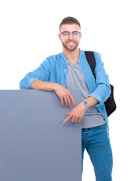 Portrait of a smiling male student holding blank board - Fotoğraf, Görsel