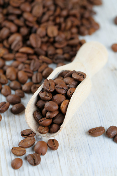 coffee beans on wooden surface - Fotoğraf, Görsel