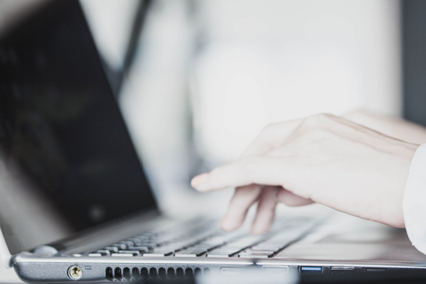 Female hands typing on a laptop - Foto, Imagem