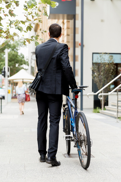 Young businessmen with a bike - Foto, Imagem