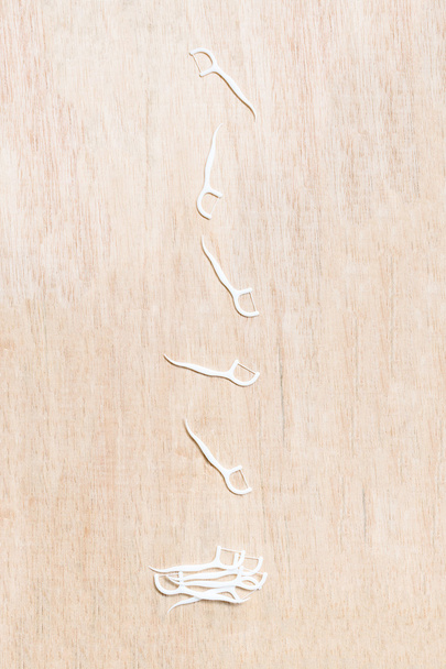 Oral Device : Dental flossers on wooden background - Photo, Image