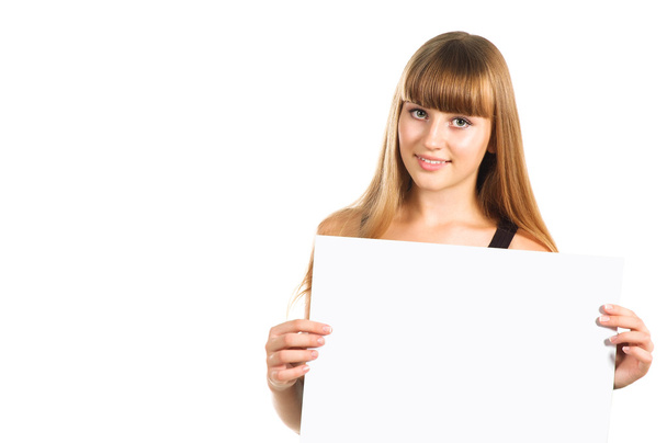 Linda chica adolescente presentando cartel en blanco, de media longitud, aislado en
 - Foto, imagen