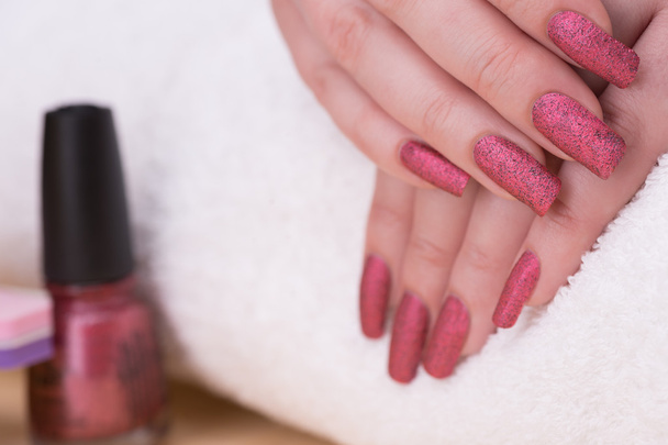 Fingernails with reddish matte glitter polish  - Photo, image