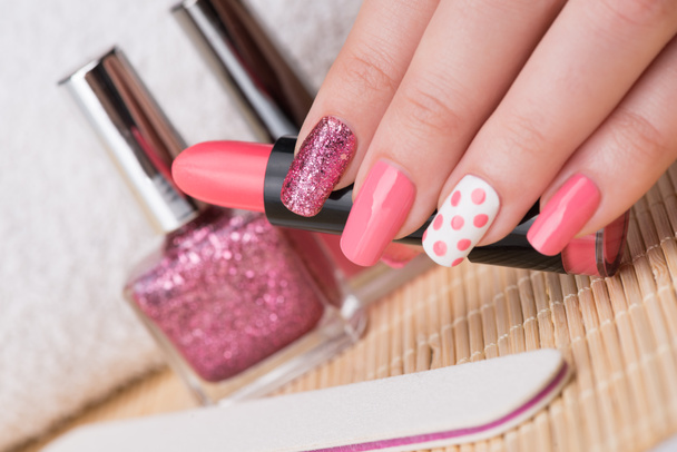 Nails with glitter, pink and white polish - Photo, Image