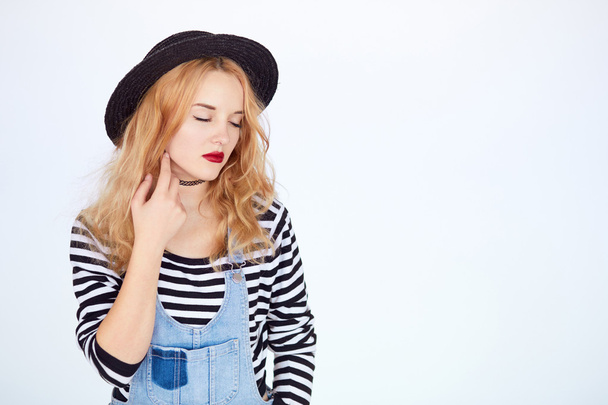 hipster young woman in trendy clothes dreaming - 写真・画像