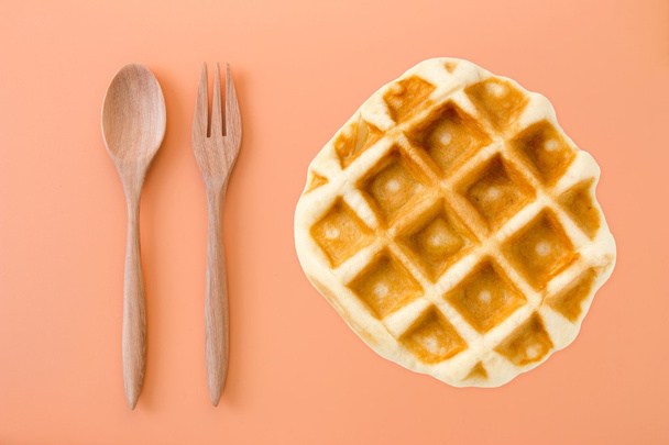 waffle with chocolate and caramel on a yellow background - Foto, Imagen