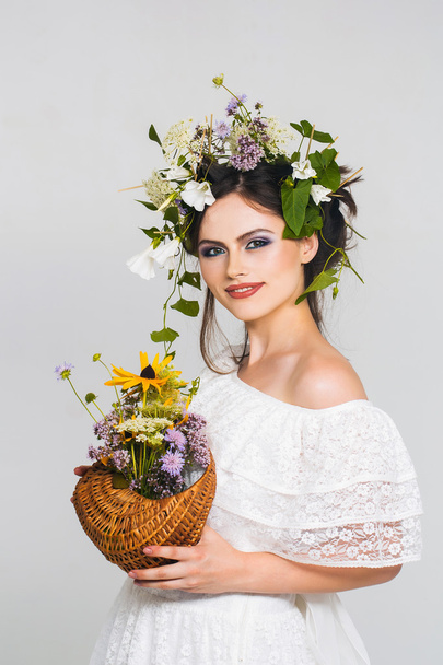 young pretty girl with flower wreath - Photo, image