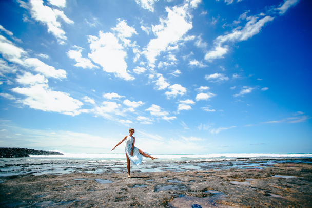 young woman on beach - Фото, изображение