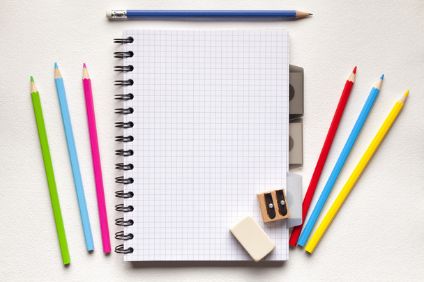 Notebook and school supplies on paper background - Photo, Image