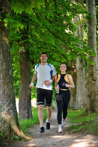 Young couple jogging - Valokuva, kuva