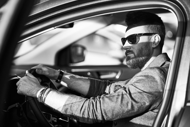 Handsome confident man in the car  - Foto, afbeelding