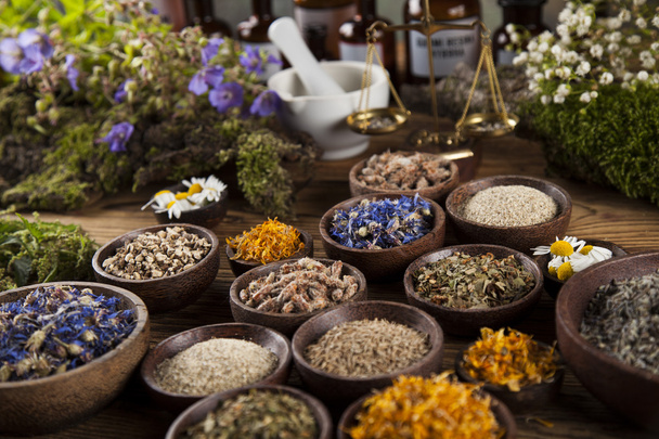 Herbs and mortar on wooden table - Photo, Image