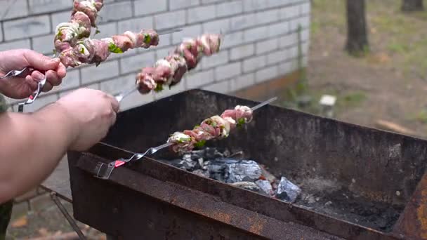 Man fries kebab on skewers, a barbecue. - Footage, Video